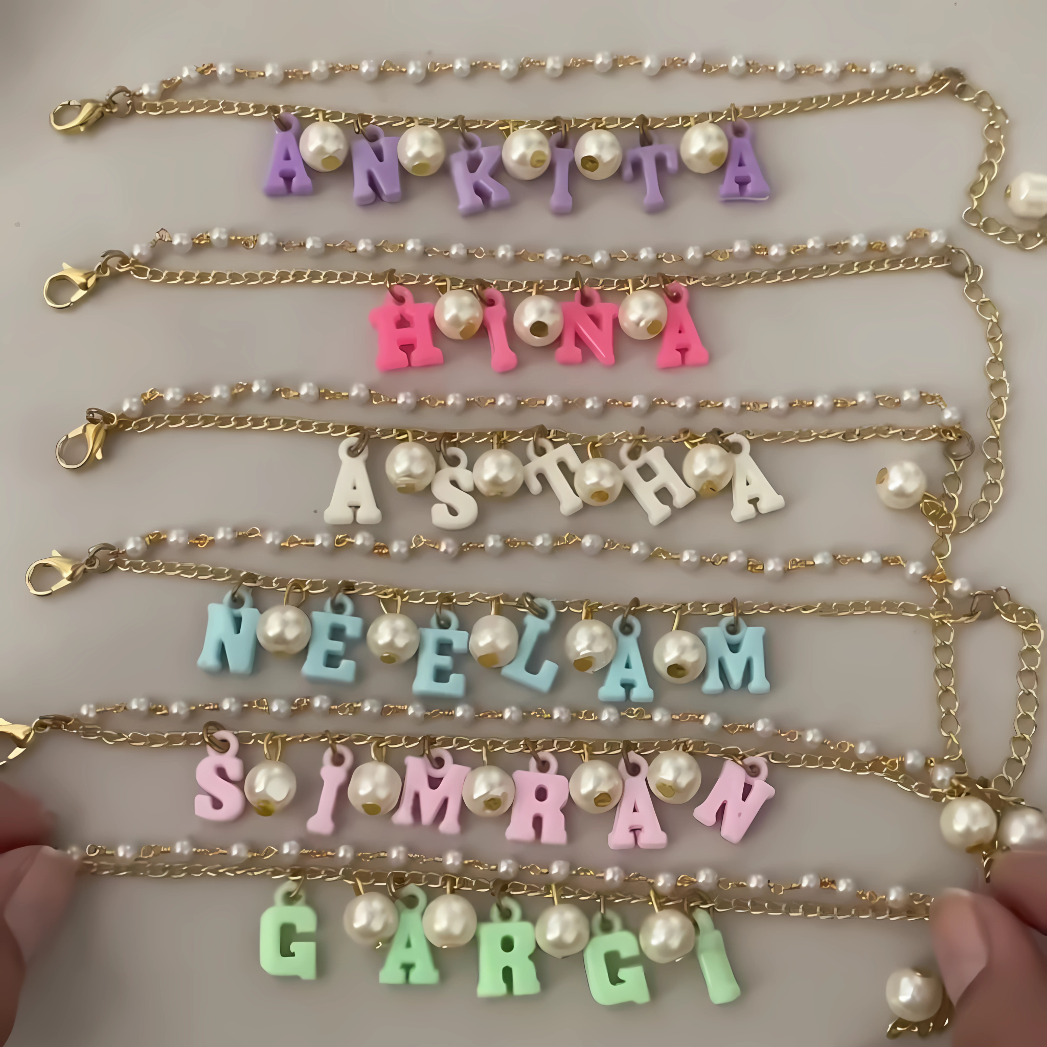 Personalized gold chain bracelet for sister with hanging name and pearls – Rakhi gift for modern girls