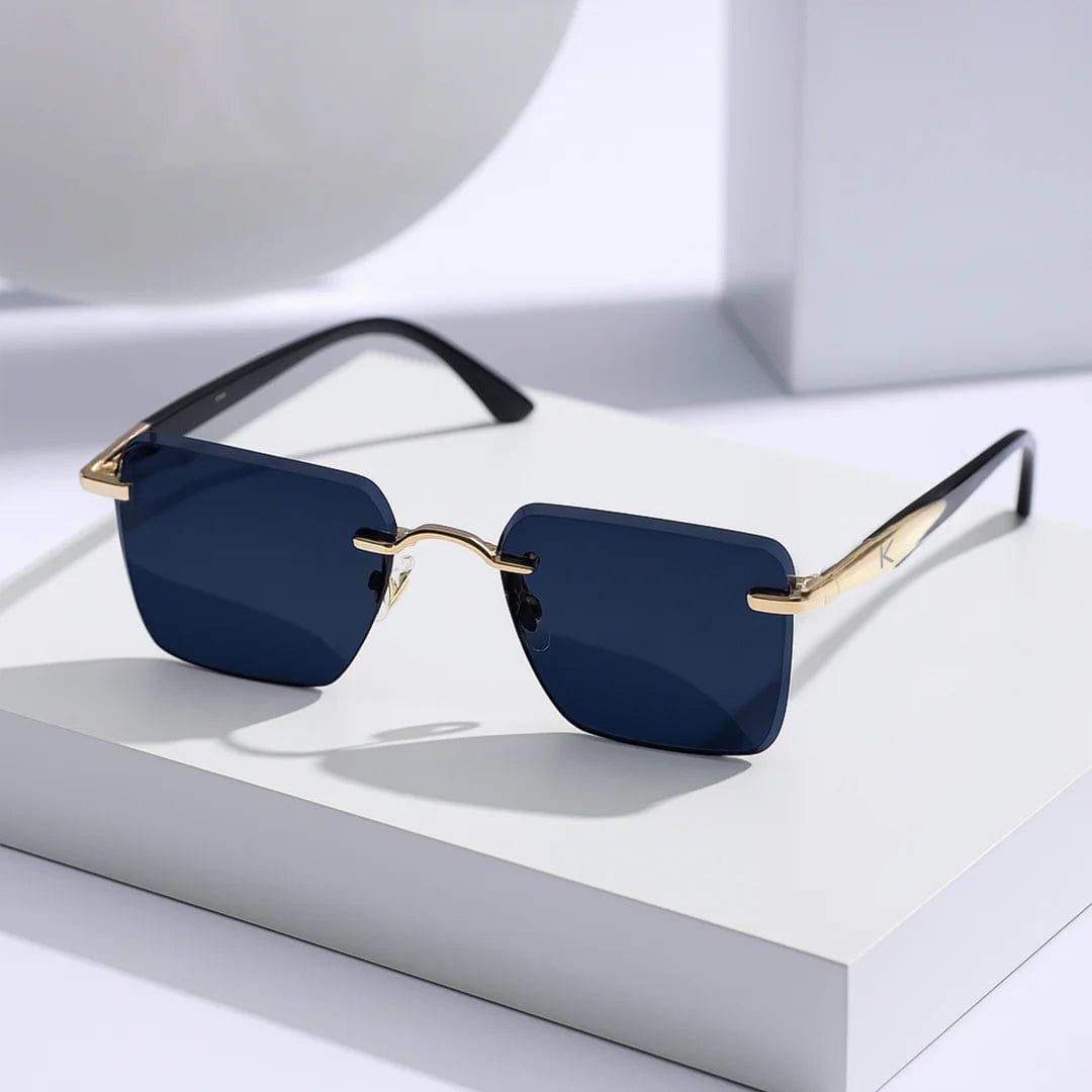 Square rimless black sunglasses with gold detailing, displayed on white minimal box – personalized gift for men