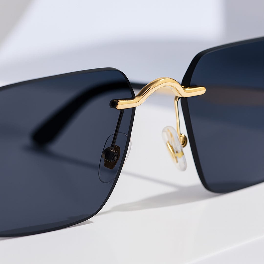 Close-up of gold nose bridge and rimless lens of premium sunglasses – luxury custom eyewear