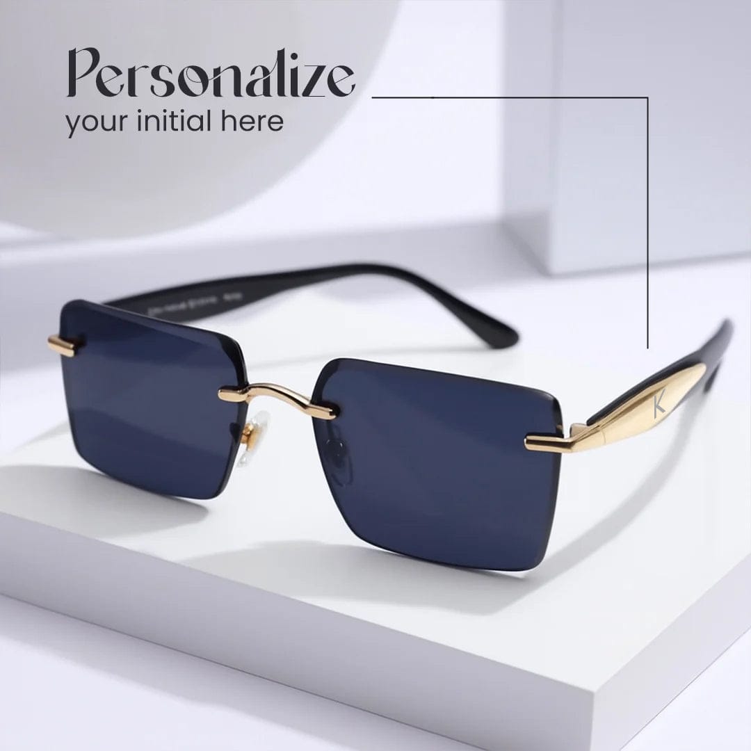 Square rimless black sunglasses with gold detailing, displayed on white minimal box – personalized gift for men