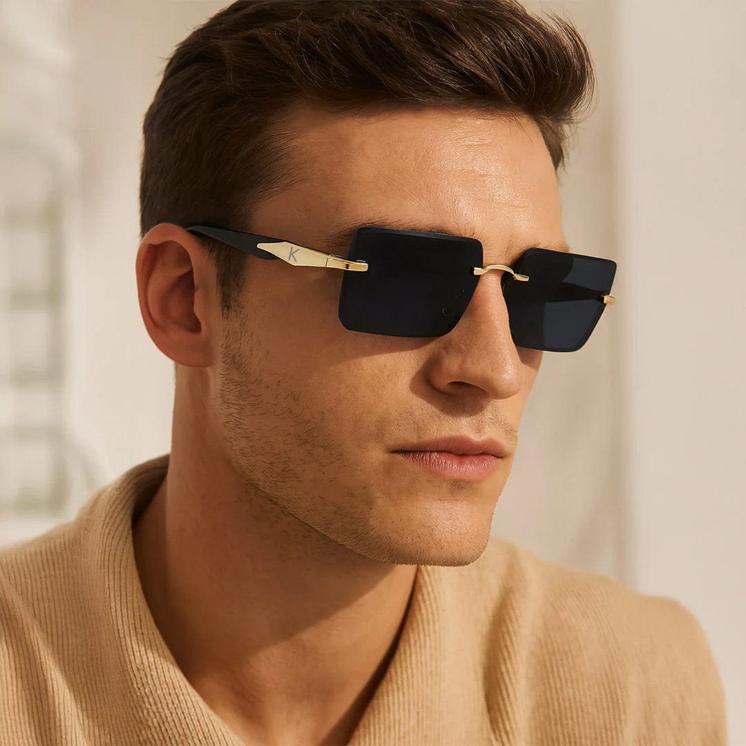 Man wearing personalized black square rimless sunglasses with gold bridge and custom initial arm – Rakhi gift for brother